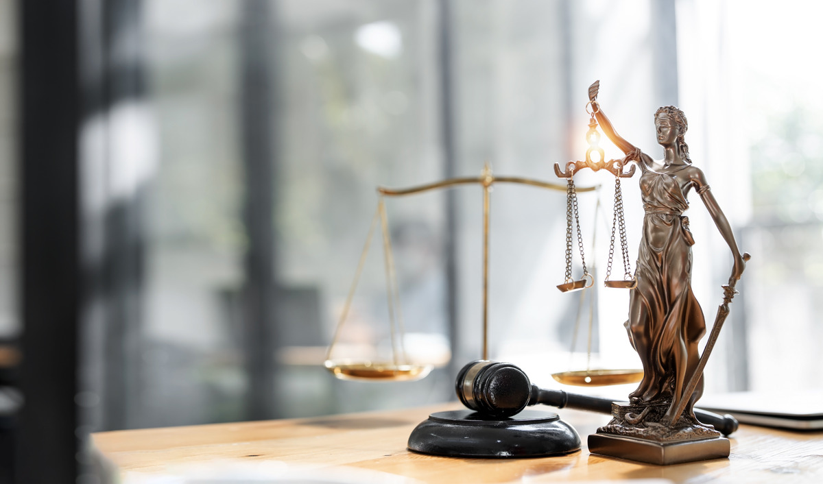 scales of justice with gavel on a table